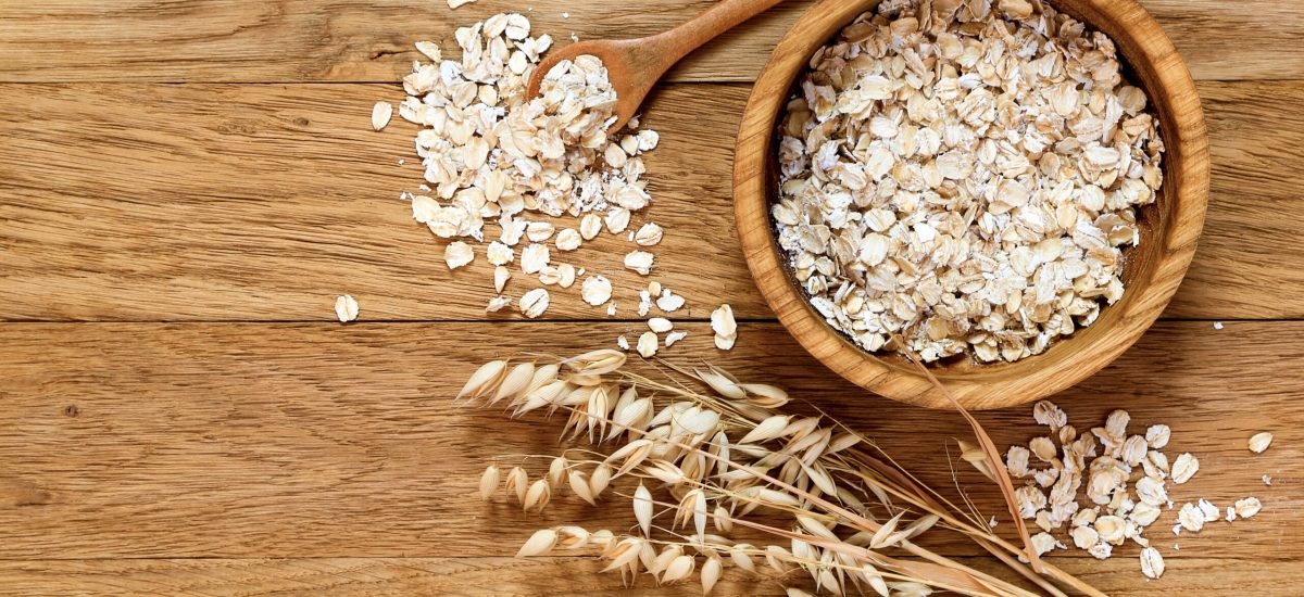 Rolled,Oats,And,Oat,Ears,Of,Grain,On,A,Wooden